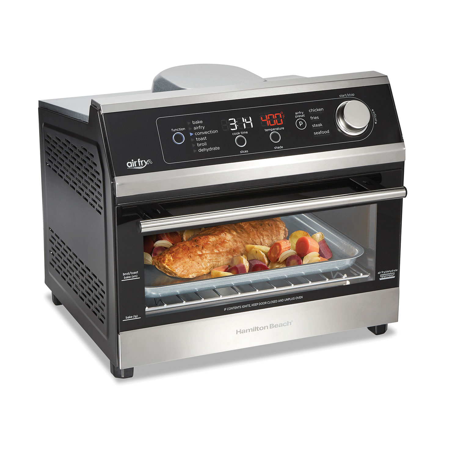 Hamilton Beach 31220 compact countertop oven with one cavity, digital controls and a staged meal on its rack