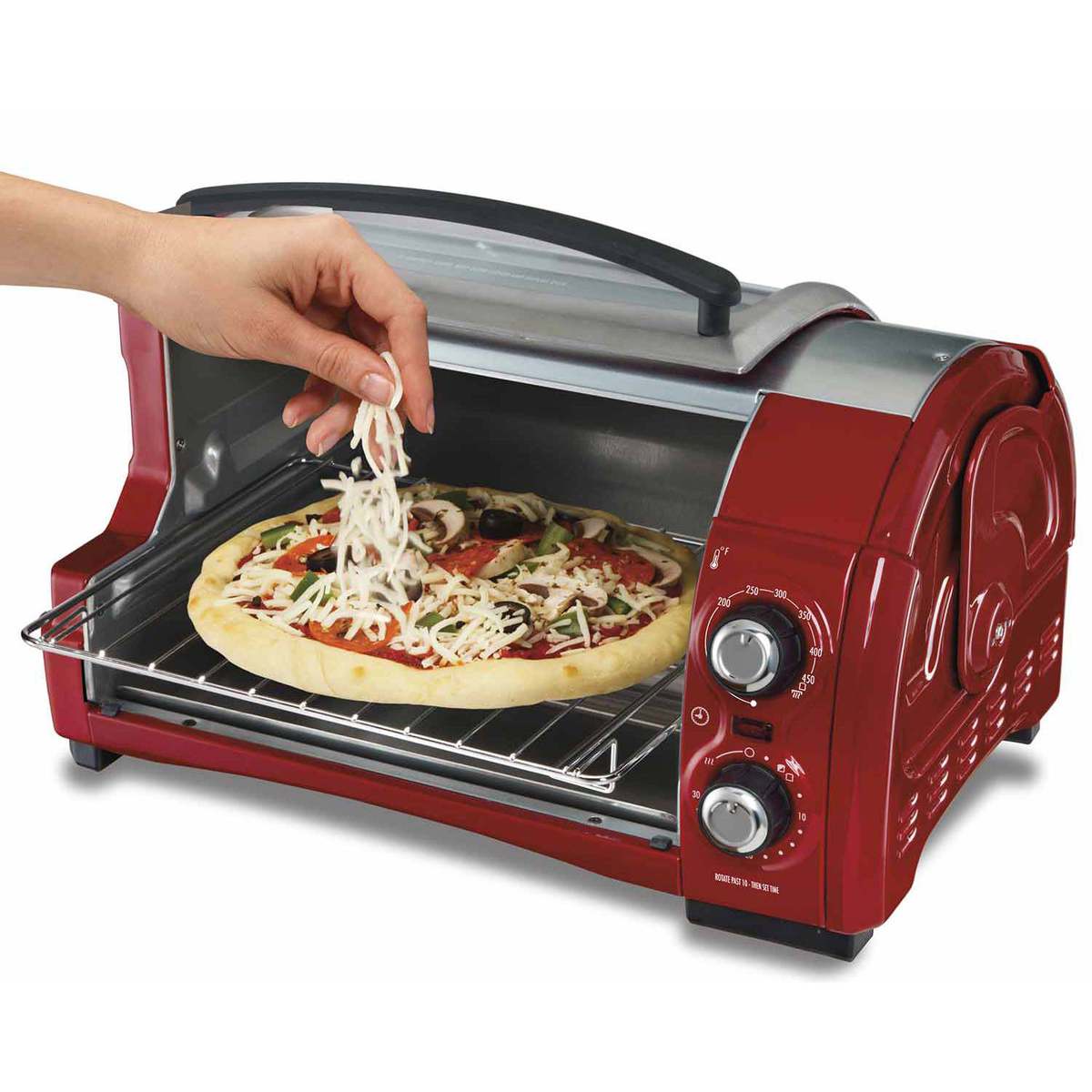 Hamilton Beach Easy Reach toaster oven in Candy Apple Red, exact unsuffixed model 31337, with the roll-top opening and a staged pizza