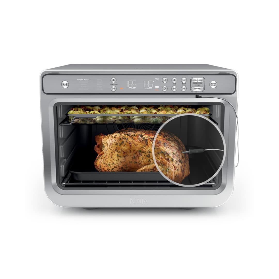 Ninja Prestige Pro XL Countertop Oven and Air Fryer DT551 with the wired Pro Cook probe shown inside a roast